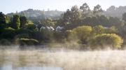 Lake House across the misty lake photo Lisa Cohen